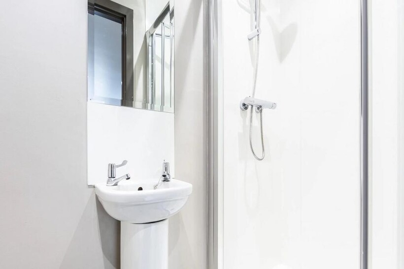 A modern and clean bathroom featuring a sleek s...