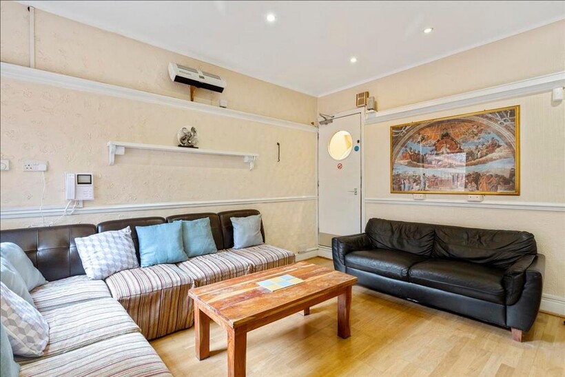 Spacious living room featuring comfortable seat...