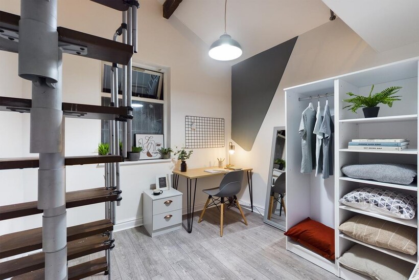 A stylish and tidy double bedroom featuring a s...