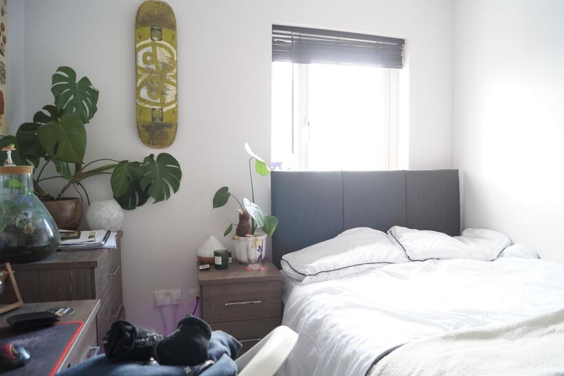 Cozy double bedroom featuring a comfortable bed...