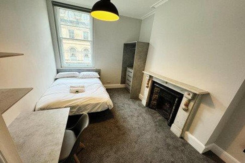 A bright and inviting double bedroom featuring ...