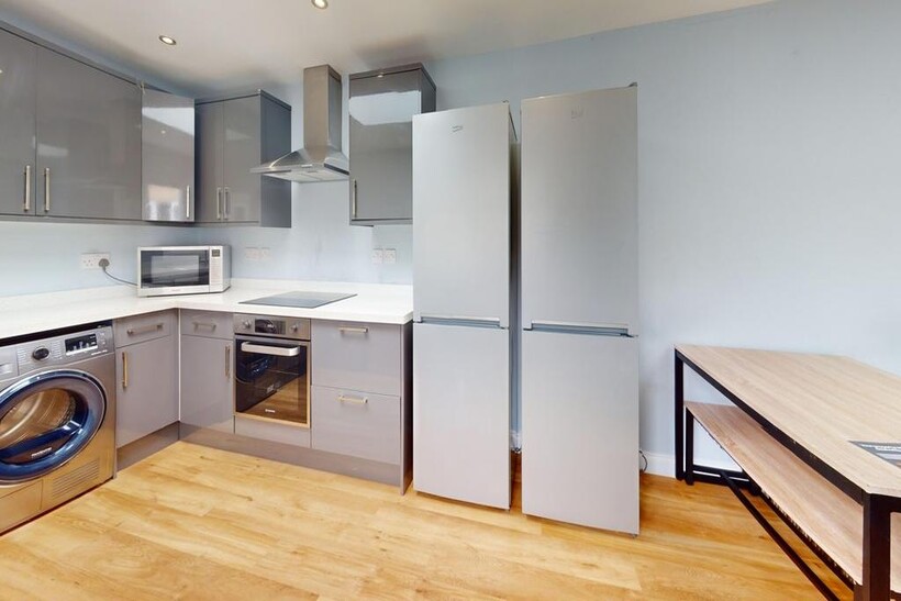 A modern and spacious kitchenette equipped with...