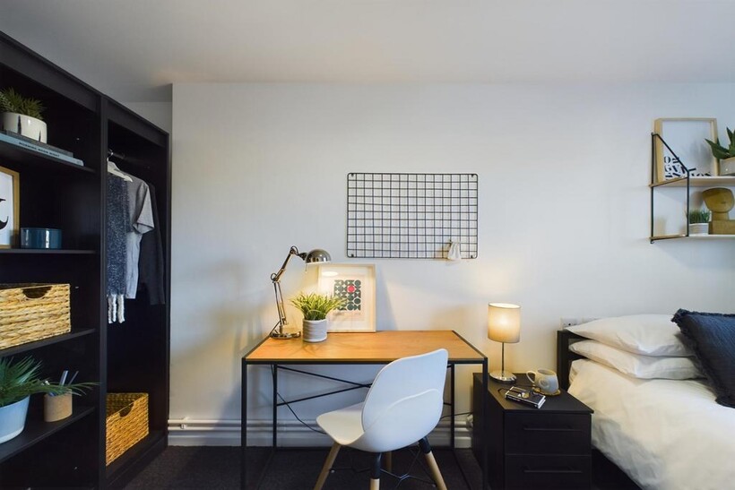 A bright and inviting double bedroom featuring ...
