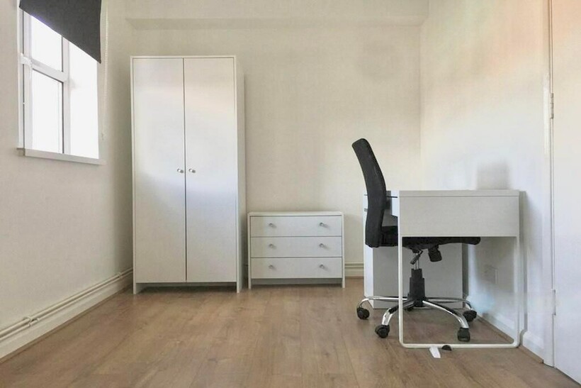 Bright and spacious double bedroom featuring a ...