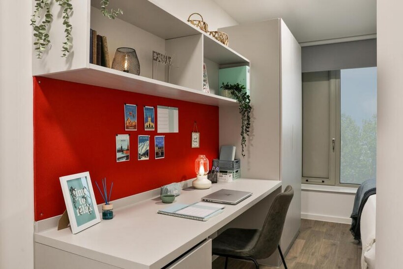 A stylish double bedroom featuring a vibrant re...