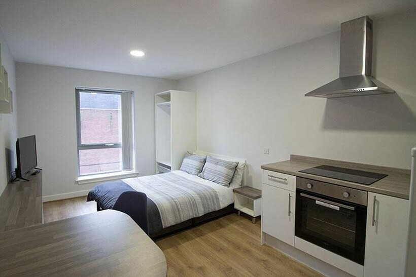 A bright and inviting double bedroom featuring ...