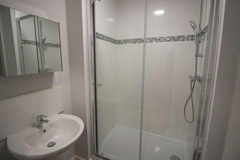 Modern bathroom suite featuring a spacious show...