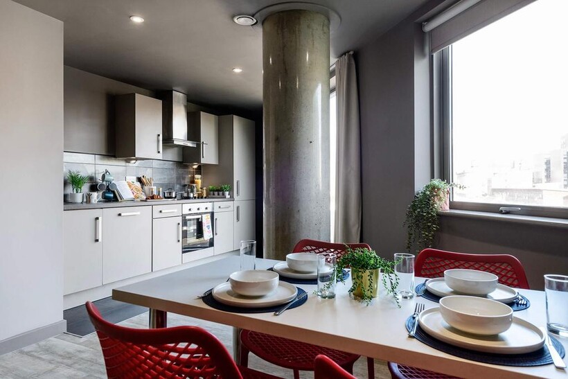 Modern and stylish kitchen space featuring slee...