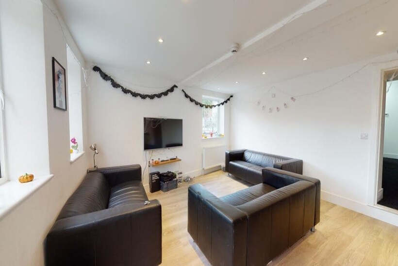 A bright and inviting living room featuring sty...