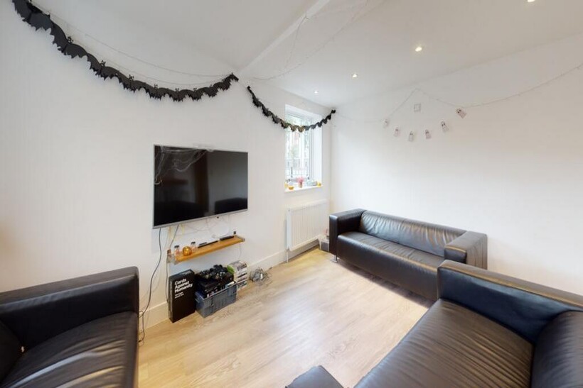A stylish and inviting living room featuring mo...