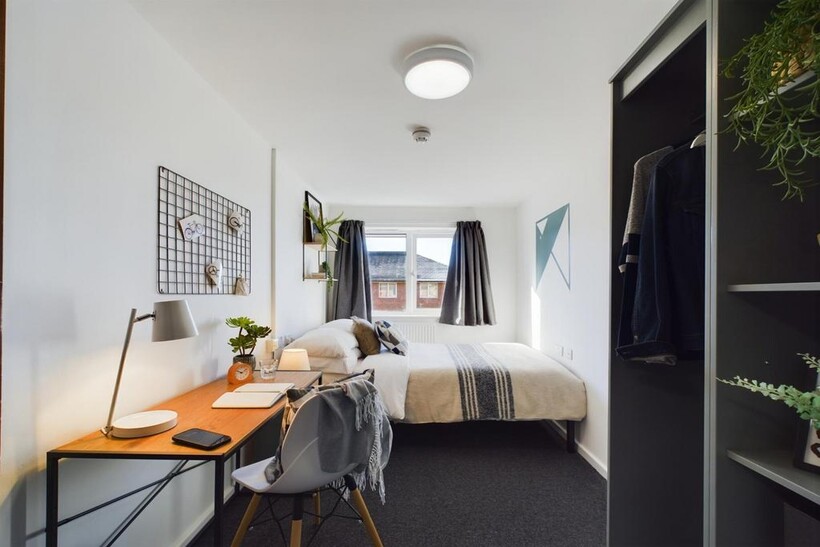 A bright and spacious double bedroom featuring ...
