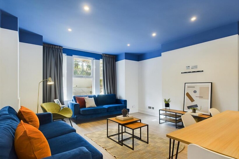 A spacious and stylish modern living room, perf...