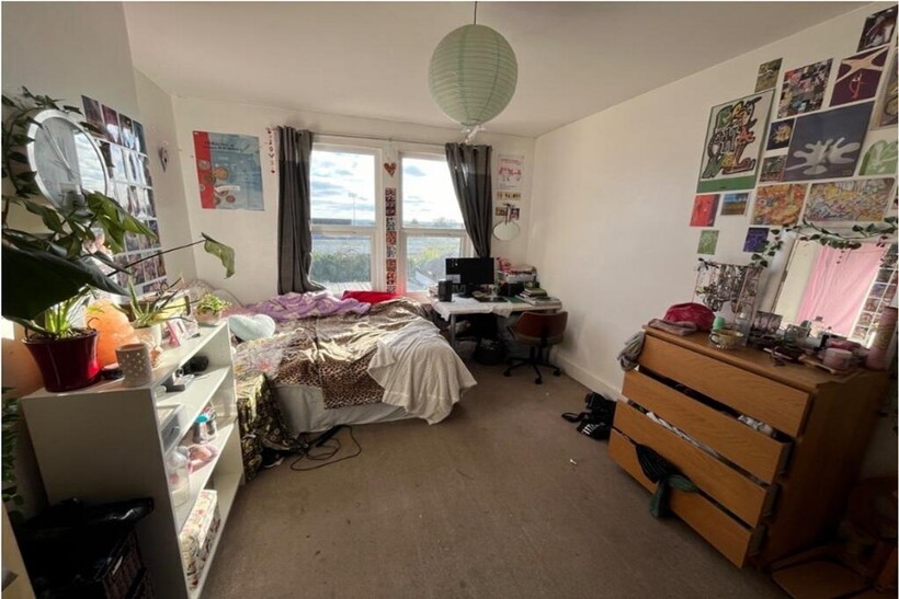 A spacious and inviting large double bedroom fi...