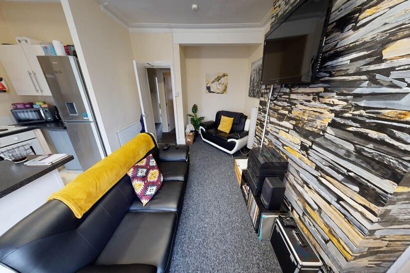 A comfortable living room featuring modern blac...