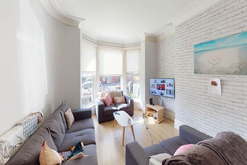 Bright and welcoming living room featuring a sp...