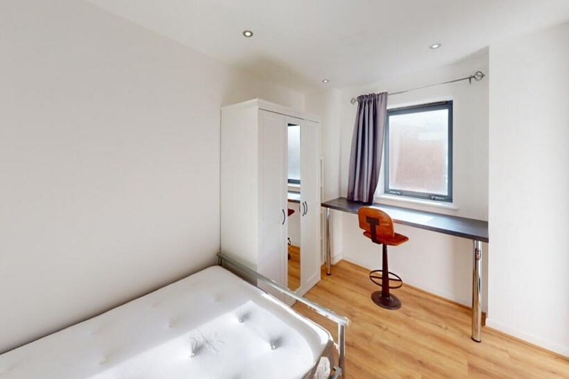 A bright and spacious double bedroom featuring ...
