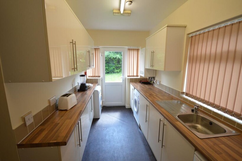 Bright and well-maintained galley kitchen with ...