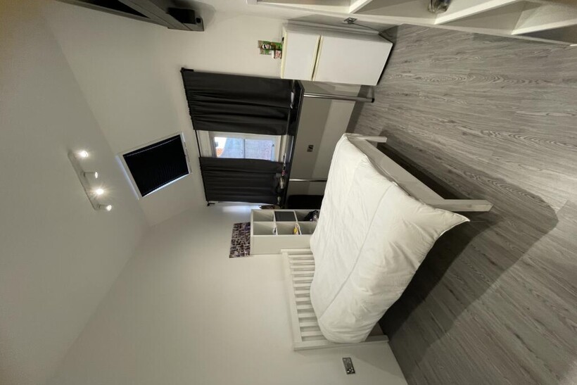 Bright and modern double bedroom featuring a ne...