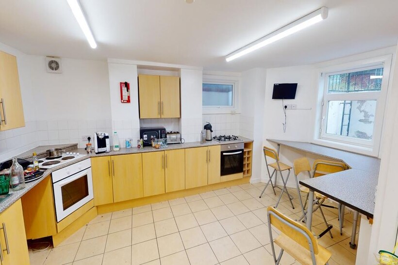 Bright and spacious kitchen featuring ample cab...