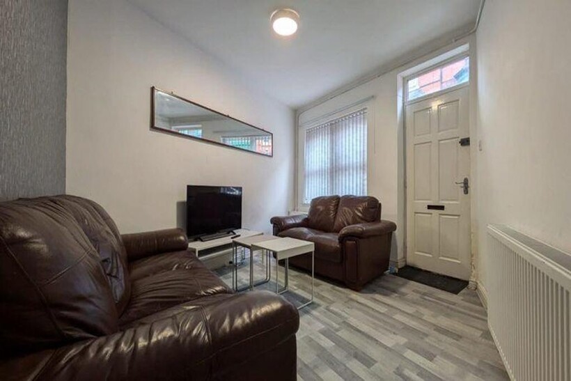 A bright and inviting living room featuring com...