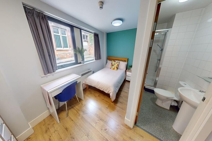 Bright and tidy double bedroom featuring a comf...