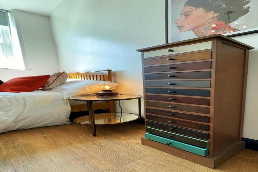 A stylish and well-lit double bedroom featuring...