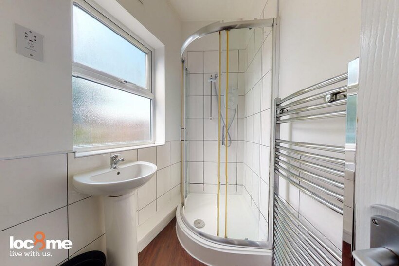 A bright and modern bathroom featuring a spacio...