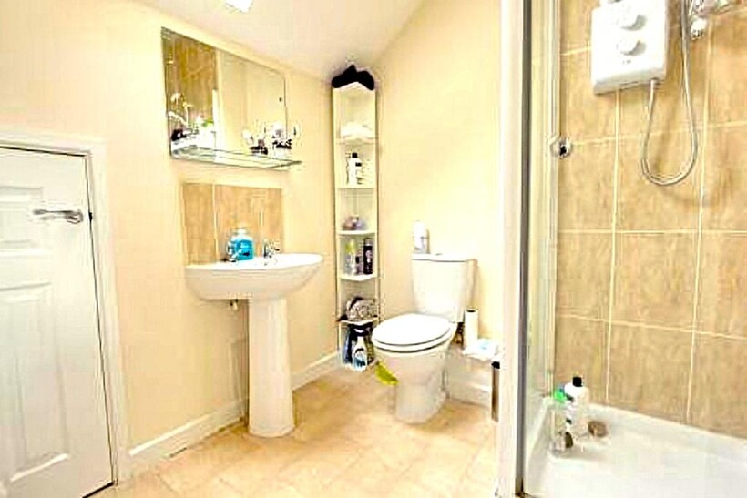 A clean and bright bathroom featuring modern fi...