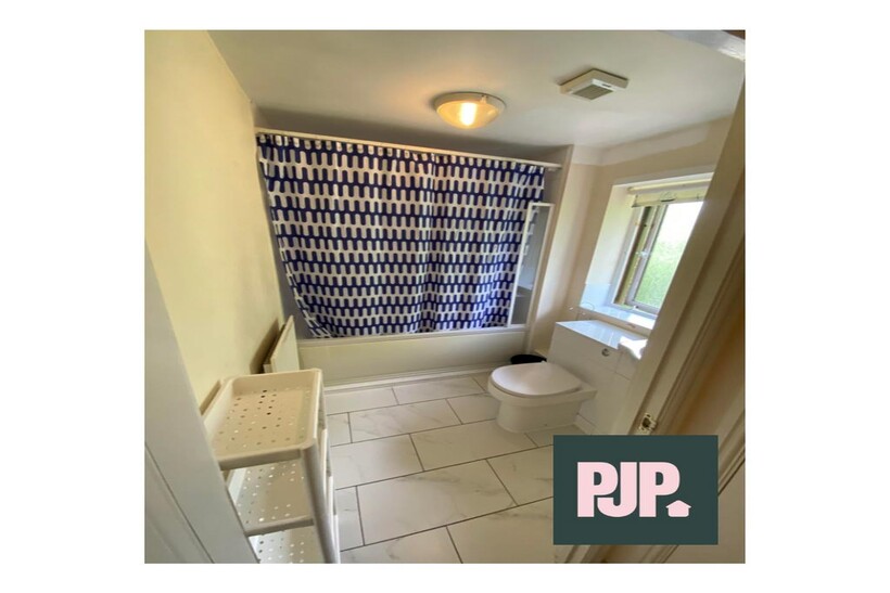 A bright and clean bathroom featuring modern fi...