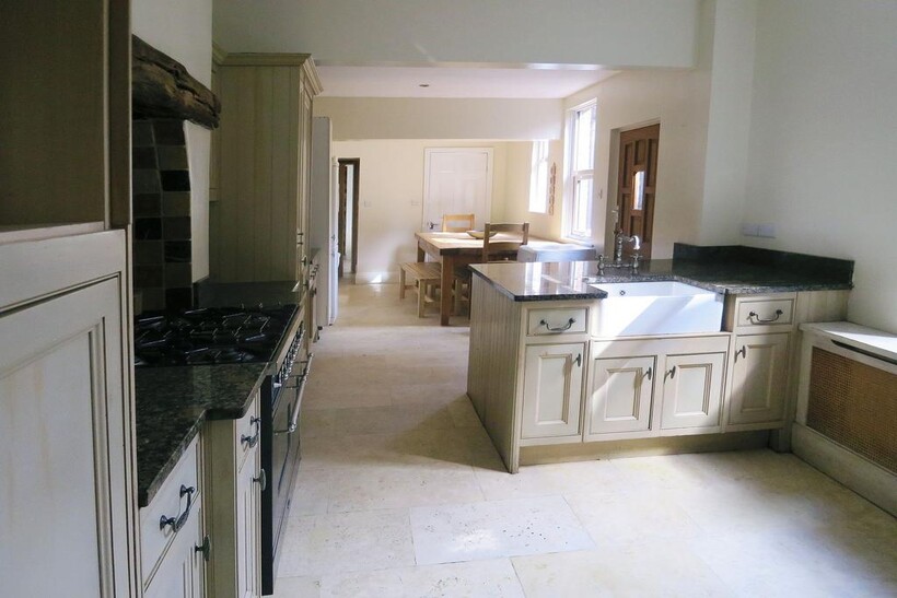 Bright and inviting kitchen with ample cabinetr...
