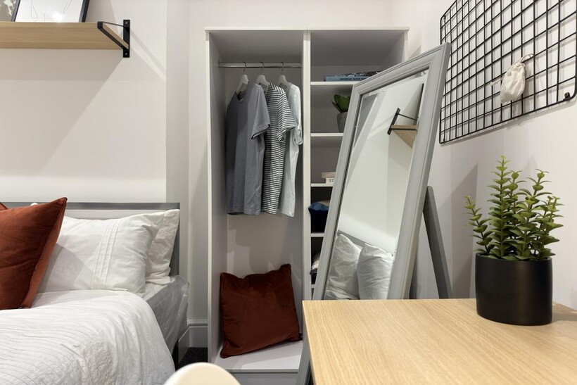 A stylish and inviting double bedroom with ampl...