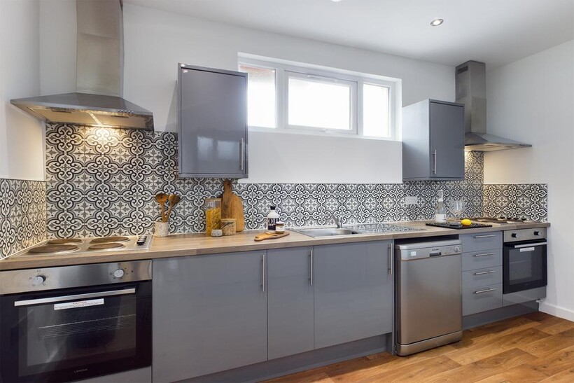 A modern and clean kitchenette featuring stylis...