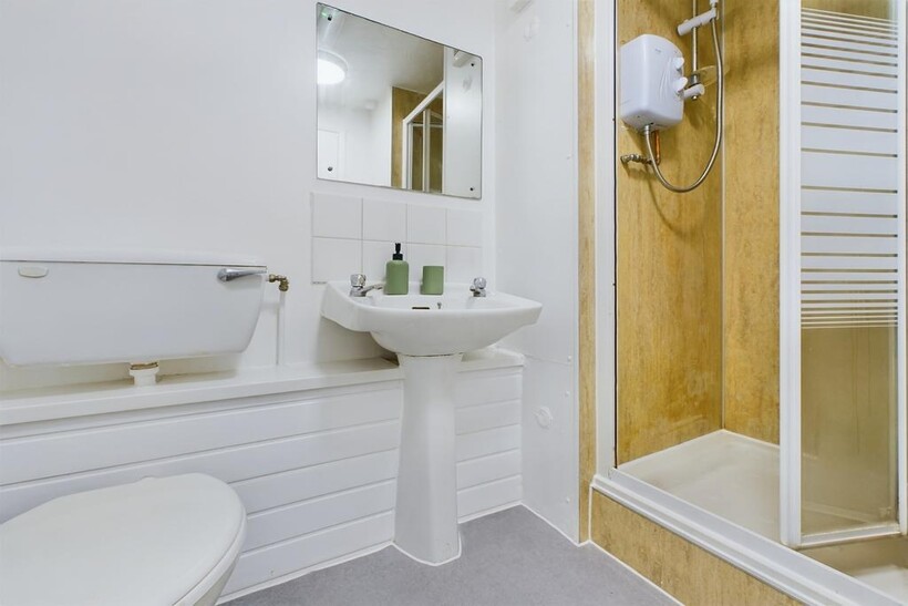 A bright and clean bathroom featuring a modern ...