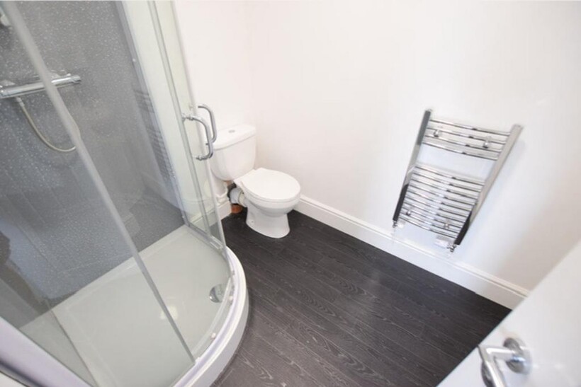 A modern and clean bathroom featuring a shower ...