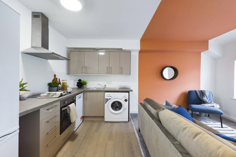 A stylish and modern kitchenette featuring ampl...