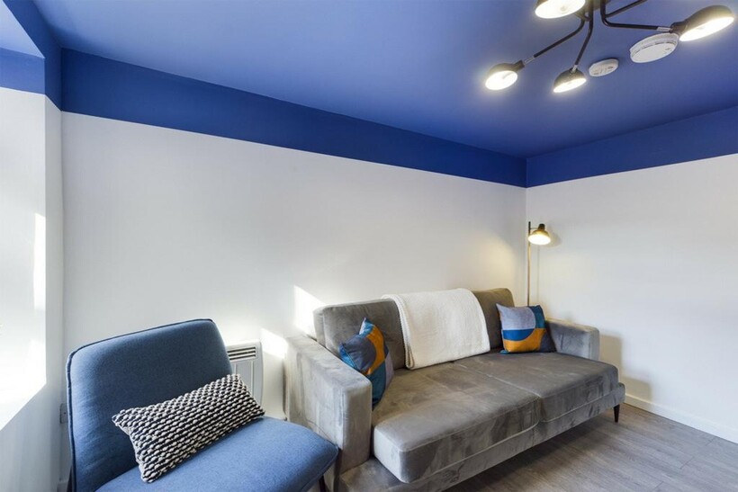 A bright and inviting living room featuring mod...