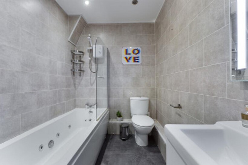 A modern and clean bathroom featuring a stylish...