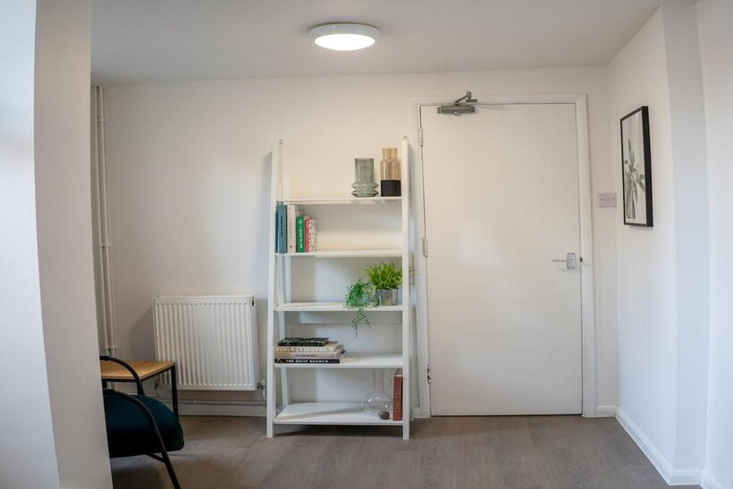 A bright and tidy hallway with modern decor and...