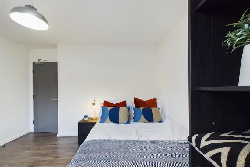 A bright and inviting double bedroom featuring ...