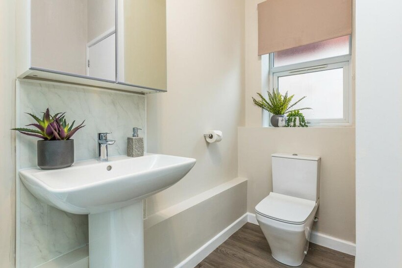 A modern and clean bathroom featuring stylish f...