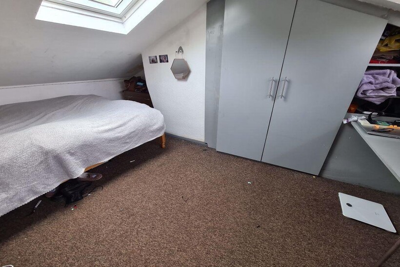 A clean and well-lit small room featuring a sky...