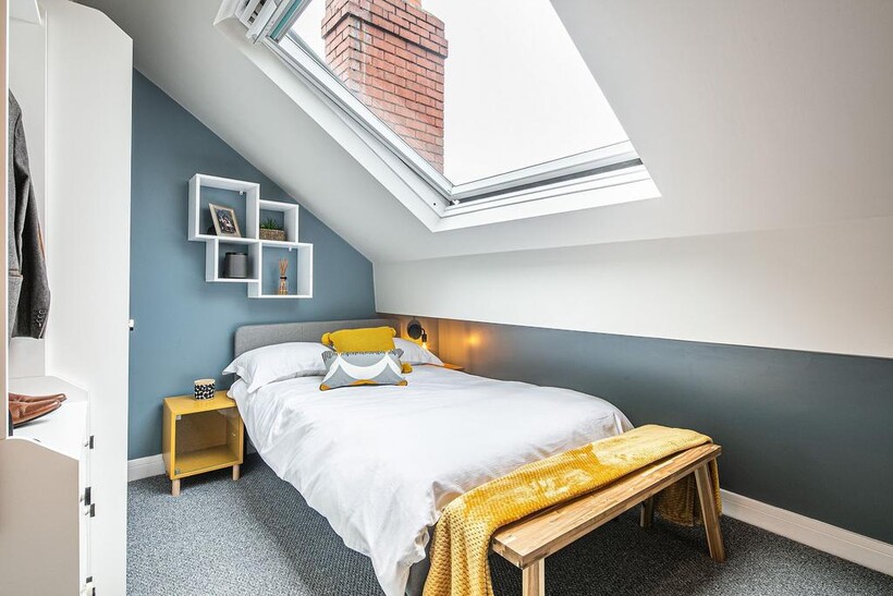 A bright and inviting double bedroom with a sky...