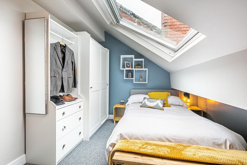 Bright and modern bedroom featuring a large sky...