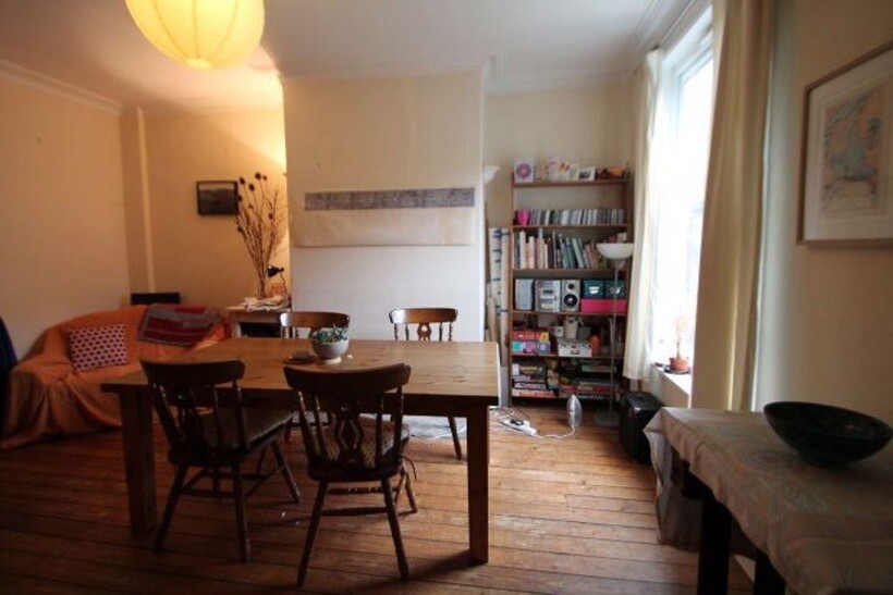 A bright and inviting living room with ample na...