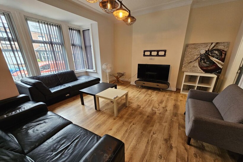 A bright and inviting living room featuring mul...