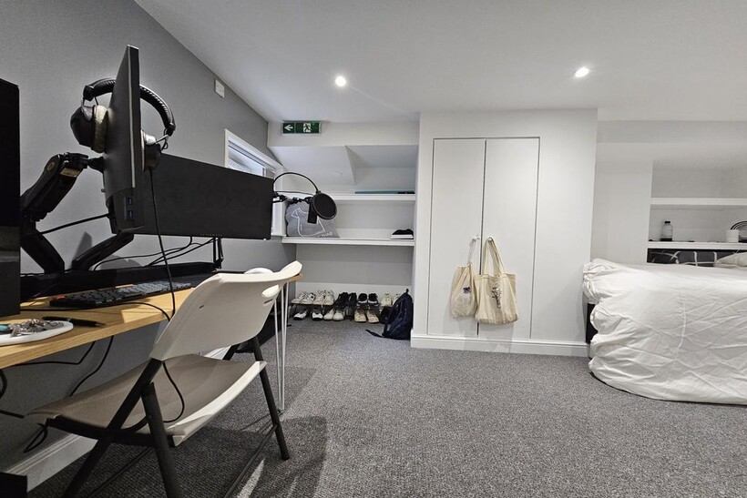 A well-maintained bedroom featuring a comfortab...