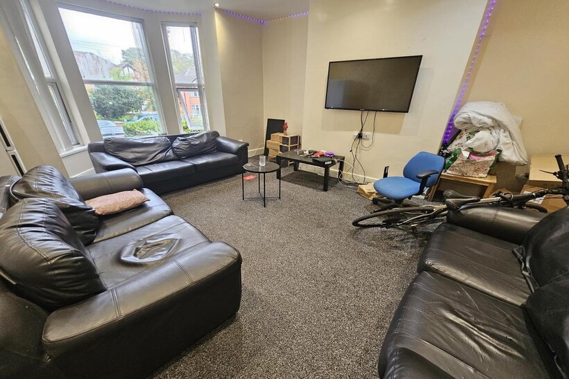 A spacious and well-maintained living room feat...