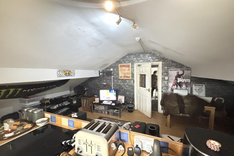 A cozy and well-maintained living room with mod...