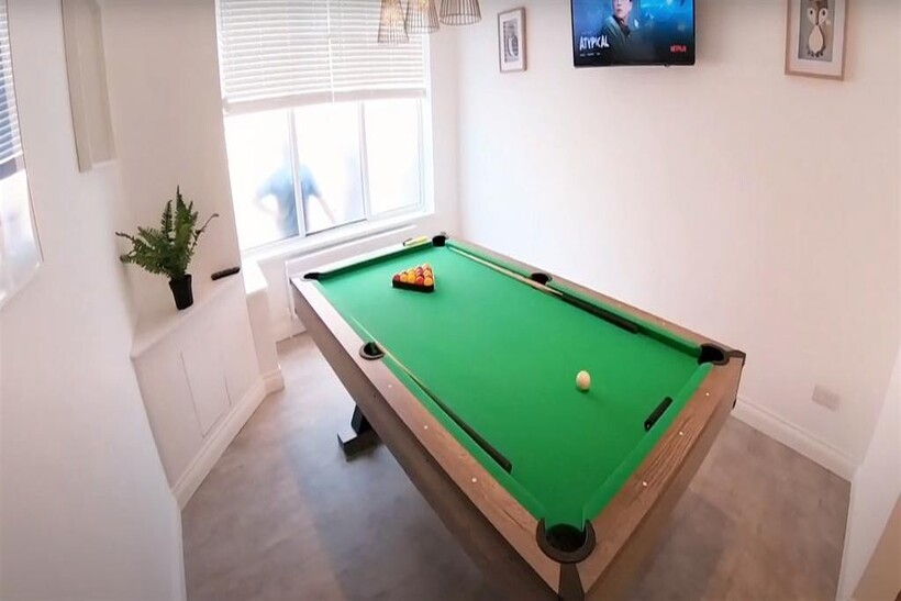 A bright and tidy living room featuring a vibra...