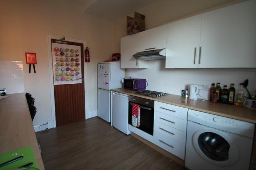 A modern, well-maintained kitchen featuring amp...